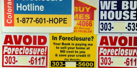 Signs posted on the wall at the offices of the Colorado Foreclosure Hotline Tuesday morning. The Colorado Foreclosure Hotline is a free service, those posted on the wall charge a percentage. Andy Cross, The Denver Post  (Photo By Andy Cross/The Denver Post via Getty Images)
