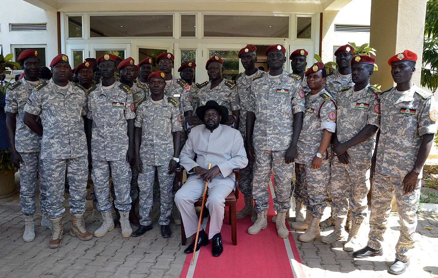 JUBA, SOUTH SUDAN - DECEMBER 28:  South Sudanese President Salva Kiir Mayardit (C) poses family photo with the members of Presidential Guard during a meeting at the Presidential Palace in Juba, South Sudan on December 28, 2014. (Photo by Samir Bol/Anadolu Agency/Getty Images)