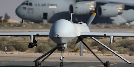 UNSPECIFIED, UNSPECIFIED - JANUARY 07:  A U.S. Air Force MQ-1B Predator unmanned aerial vehicle (UAV), carrying a Hellfire air-to-surface missile lands at a secret air base in the Persian Gulf region on January 7, 2016. The U.S. military and coalition forces use the base, located in an undisclosed location, to launch airstrikes against ISIL in Iraq and Syria, as well as to distribute cargo and transport troops supporting Operation Inherent Resolve. The Predators at the base are operated and maintained by the 46th Expeditionary Reconnaissance Squadron, currently attached to the 386th Air Expeditionary Wing.  (Photo by John Moore/Getty Images)