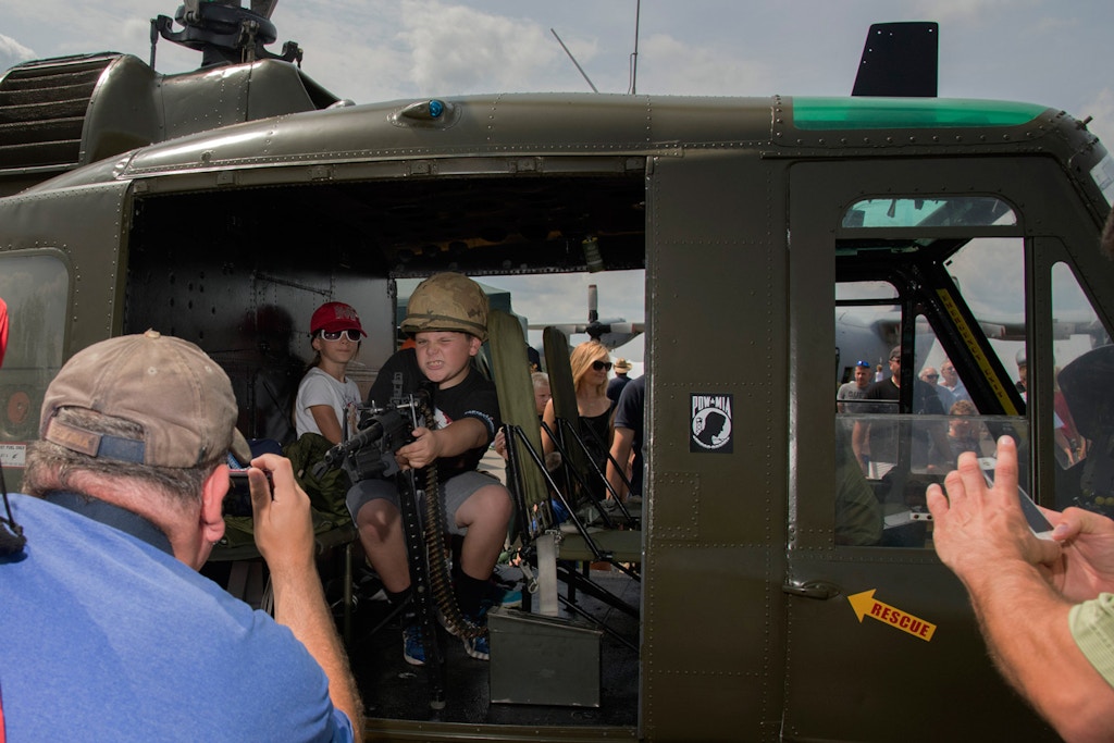 Taking Aim from Vietnam Era Helicopter, NY Air Show - Newburgh, Ft. Stewart,  NY. 2015