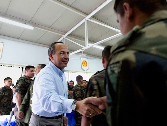 Mexican President Felipe Calderon greets a soldier after a breakfast at the base of the 43th Military zone in Apatzingan, Mexico on  Wednesday, Jan. 03, 2007. President Calderon, who sent 7,000 troops to his home state of Michoacan immediately after taking office on Dec. 1,  now has announced that is sending some 3,300 soldiers and federal police officers to fight drug gangs in the crime-plagued border city of Tijuana. (AP Photo/Guillermo Arias)