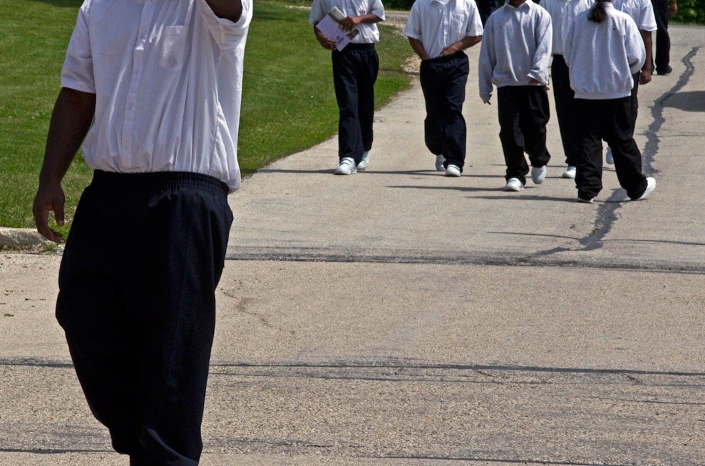 Youths make their way to class at the Wisconsin Department of Corrections Ethan Allen School, in Wales, Wis, May 20, 2010.