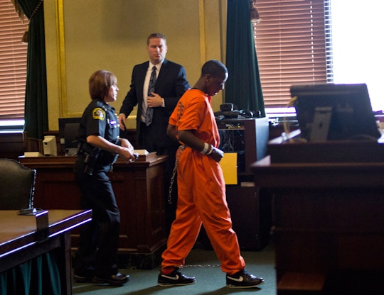Juwan Wickware, 19, is escorted out of the court room during his sentencing by Genesee Circuit Judge Archie Hayman at the Genesee County Court House on Friday, July 26, 2013. The next round of witnesses are scheduled for Friday, August 9, 2013. (AP Photo/The Journal, Zack Wittman)