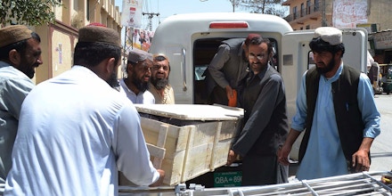 Pakistani security officials and hospital staff move a dead body into a morgue in Quetta on May 22, 2016, transported to the hospital following a drone strike in the remote town of Ahmad Wal in Balochistan that targeted Afghan Taliban Chief Mullah Akhtar Mansour.Afghan authorities scrambled May 22 to confirm the fate of Taliban leader Mullah Akhtar Mansour after US officials said he was likely killed in drone strikes -- a potential blow to the resurgent militant movement. / AFP / BANARAS KHAN (Photo credit should read BANARAS KHAN/AFP/Getty Images)