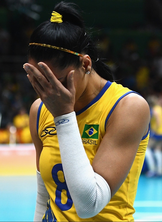RIO DE JANEIRO, BRAZIL - AUGUST 17:  Jaqueline de Carvalho Endres of Brazil cries after being defeated by China during the Women's Quarterfinal match between China and Brazil on day 11 of the Rio 2106 Olympic Games at the Maracanazinho on August 17, 2016 in Rio de Janeiro, Brazil.  (Photo by David Ramos/Getty Images)