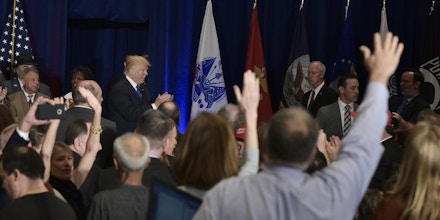 Reporters raise their hands with questions for Republican presidential nominee Donald Trump shortly before he walked out of the room at a campaign event at the Trump International Hotel, in Washington, DC on September 16, 2016. / AFP / MANDEL NGAN        (Photo credit should read MANDEL NGAN/AFP/Getty Images)
