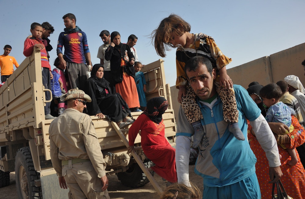 2862640 06/01/2016 A truck with Sunni Arab refugees fleeing ISIS-occupied areas to Kurds seen here near the city of Kirkuk, Iraq. Dmitriy Vinogradov/Sputnik via AP