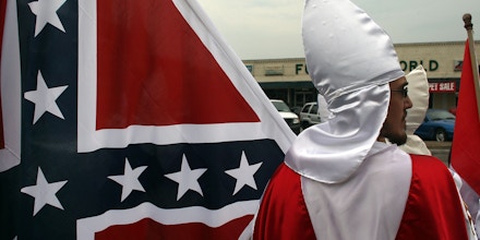 PULASKI, TN - JULY 11:  Members of the Fraternal White Knights of the Ku Klux Klan participate in the 11th Annual Nathan Bedford Forrest Birthday march July 11, 2009 in Pulaski, Tennessee. With a poor economy and the first African-American president in office, there has been a rise in extremist activity in many parts of America. According to the Southern Poverty Law Center in 2008 the number of hate groups rose to 926, up 4 percent from 2007, and 54 percent since 2000. Nathan Bedford Forrest was a lieutenant general in the Confederate Army during the American Civil War and played a role in the postwar establishment of the first Ku Klux Klan organization opposing the reconstruction era in the South.  (Photo by Spencer Platt/Getty Images)