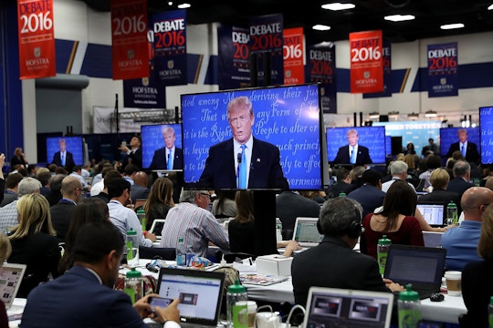 Republican presidential nominee Donald Trump appears on television monitors in the media center during the first presidential debate at Hofstra University on September 26, 2016 in Hempstead, New York. 
