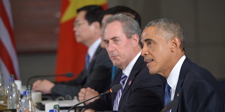 US President Barack Obama (R) speaks during a meeting with leaders from the Trans-Pacific Partnership at the US Embassy in Beijing on November 10, 2014 in Beijing. At left is US Trade Representative Mike Froman. Top leaders and ministers of the 21-member APEC grouping are meeting in Beijing from November 7 to 11. AFP PHOTO/Mandel NGAN        (Photo credit should read MANDEL NGAN/AFP/Getty Images)
