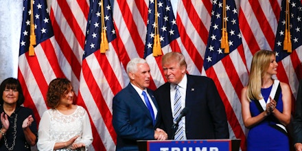 US Republican presidential candidate Donald Trump (R) joins vice presidential candidate Mike Pence onstage after a press conference in New York on July 16, 2016.   / AFP / KENA BETANCUR        (Photo credit should read KENA BETANCUR/AFP/Getty Images)