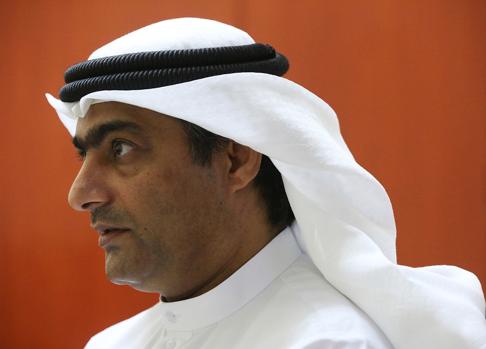 Human rights activist Ahmed Mansoor speaks to Associated Press journalists in Ajman, United Arab Emirates, on Thursday, Aug. 25, 2016. Mansoor was recently targeted by spyware that can hack into Apple's iPhone handset. The company said Thursday it has updated its security. (AP Photo/Jon Gambrell)