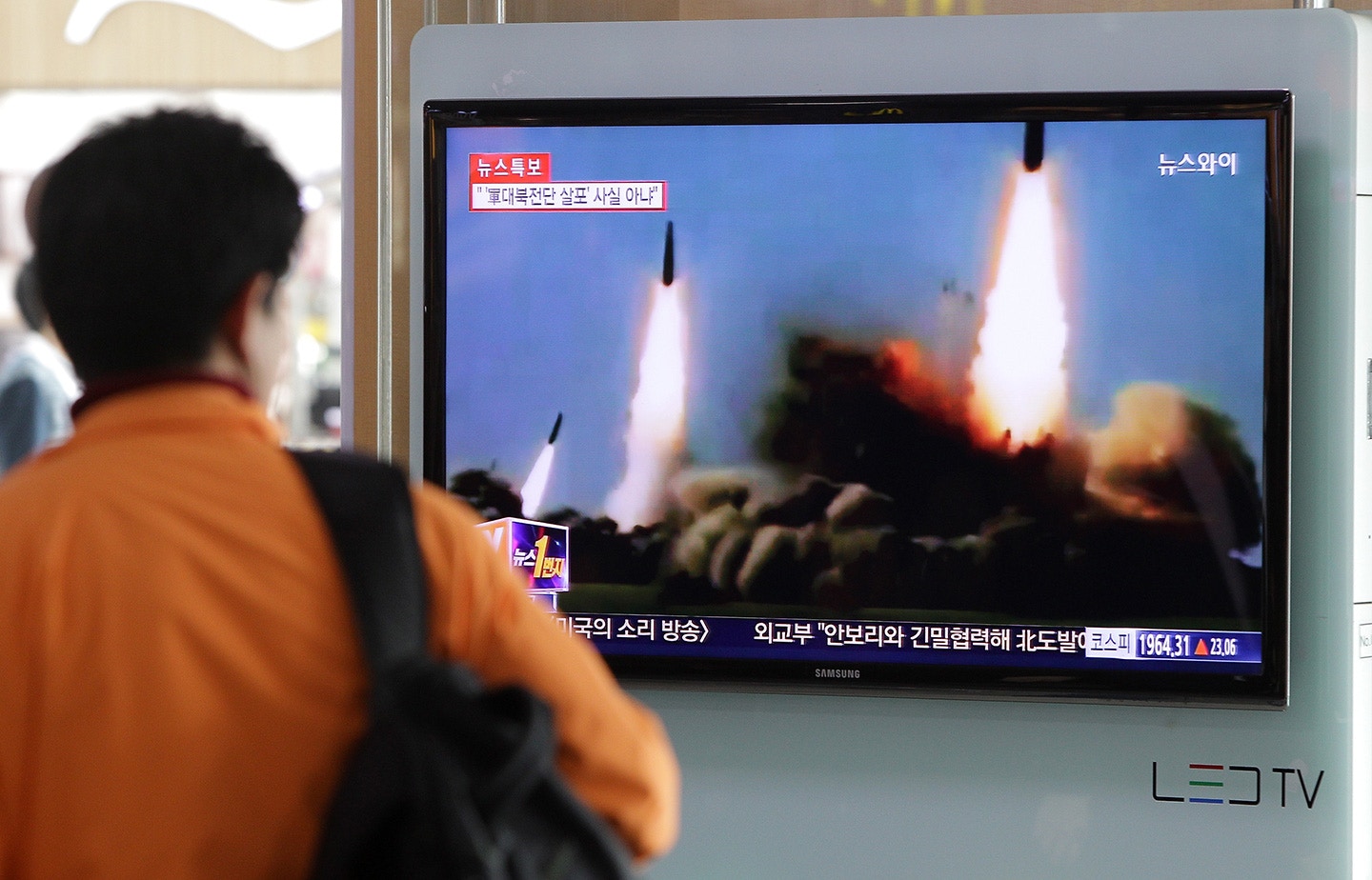 SEOUL, SOUTH KOREA - MARCH 26:  A Man watchs a television broadcast reporting the North Korean missile launch at the Seoul Railway Station on March 26, 2014 in Seoul, South Korea. North Korea test-launched two Nodong medium-range ballistic missiles into the sea off Korean peninsula's east coast on Wednesday morning, according to South Korea's defence ministry.  (Photo by Chung Sung-Jun/Getty Images)