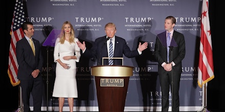 WASHINGTON, DC - OCTOBER 26:  Republican presidential nominee Donald Trump (C) delivers remarks with his children (L-R) Donald Trump Jr., Ivanka Trump and Eric Trump during the grand opening ceremony of the new Trump International Hotel October 26, 2016 in Washington, DC. The hotel, built inside the historic Old Post Office, has 263 luxry rooms, including the 6,300-square-foot 'Trump Townhouse' at $100,000 a night, with a five-night minimum. The Trump Organization was granted a 60-year lease to the historic building by the federal government before the billionaire New York real estate mogul announced his intent to run for president.  (Photo by Chip Somodevilla/Getty Images)