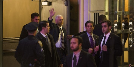 Vice President-elect Mike Pence, top center, leaves the Richard Rodgers Theatre after a performance of 