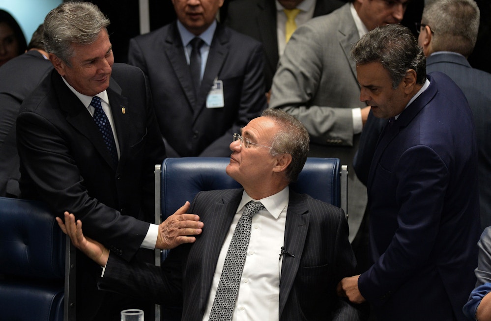 The president of the Brazilian Senate Renan Calheiros (C) speaks with Brazilian former President (1990-1992), Senator Fernando Collor de Mello (L), and opposition leader, Senator Aecio Neves (R), during a session to vote on Senator Delcidio do Amaral's cassation in Brasilia, on May 10, 2016.<br /><br /><br /><br /><br /><br /><br /><br /><br /> The interim speaker of Brazil's lower house of Congress Waldir Maranhao on Tuesday said he had reversed a decision to annul the impeachment of Brazilian President Dilma Rousseff after Calheiros on Monday had dismissed his annulment. / AFP / ANDRESSA ANHOLETE        (Photo credit should read ANDRESSA ANHOLETE/AFP/Getty Images)