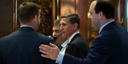 NEW YORK, NY - NOVEMBER 17: Retired Lt. Gen. Michael Flynn (C) arrives at Trump Tower, November 17, 2016 in New York City. President-elect Donald Trump and his transition team are in the process of filling cabinet and high level positions for the new administration. Trump campaign senior advisor Boris Epshteyn is seen at right. (Photo by Drew Angerer/Getty Images)