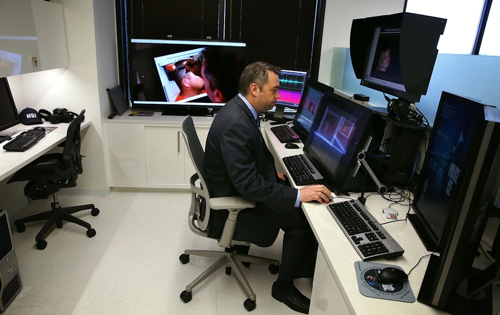 FAIRFAX, VA - JULY 22:  Special agent James Cole demonstrates during an unveiling of a major expansion of the ICE Cyber Crimes Center July 22, 2015 in Fairfax, Virginia. The center delivers computer and cyber-based technical services in support of ICE Homeland Security Investigations (HSI) cases.  (Photo by Alex Wong/Getty Images)