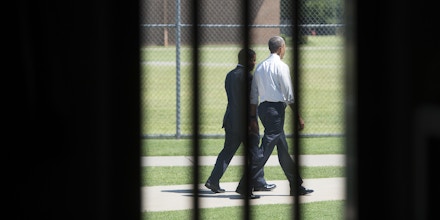 US President Barack Obama walks through the prison yard during a tour of the El Reno Federal Correctional Institution in El Reno, Oklahoma, July 16, 2015. Obama is the first sitting US President to visit a federal prison, in a push to reform one of the most expensive and crowded prison systems in the world. AFP PHOTO / SAUL LOEB        (Photo credit should read SAUL LOEB/AFP/Getty Images)