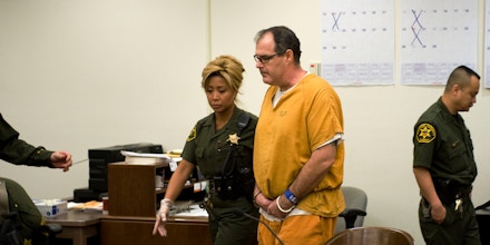 Scott Dekraai is led to his seat in the courtroom for his pre-trial hearing before Judge Thomas M. Goethals in Orange County Superior Court in Santa Ana, Calif. on Friday, Jan. 27, 2012.  