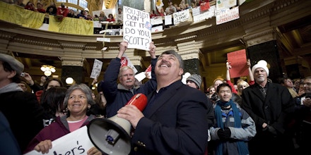 MADISON, WI - FEBRUARY 18:  National AFL-CIO President Richard Trumka speaks to protestors in the Capital Rotunda during a rally in opposition of the Wisconsin Gov. Scott Walker's  bill that threatens collective bargaining rights February 18, 2011 in Madison, Wisconsin. Many schools have closed for a third day as teachers didn't come to work and protests were held at the state capitol as legislation slashing collective bargaining rights for public workers stalled in the state senate because of Democrats disappearing to avoid a quorum vote on the measure.  (Photo by Mark Hirsch/Getty Images)
