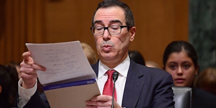 Steven T. Mnuchin looks over his notes as he appears before the US Senate Committee on Finance considering his nomination to be Secretary of the Treasury on Capitol Hill in Washington, DC. Steven Mnuchin confirmation hearing for Secretary of the Treasury, Washington DC - 19 Jan 2017 (Rex Features via AP Images)