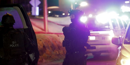 Police survey the scene after a deadly shooting at a mosque in Quebec City, Canada, Sunday, Jan. 29, 2017. Quebec Premier Philippe Couillard termed the act 