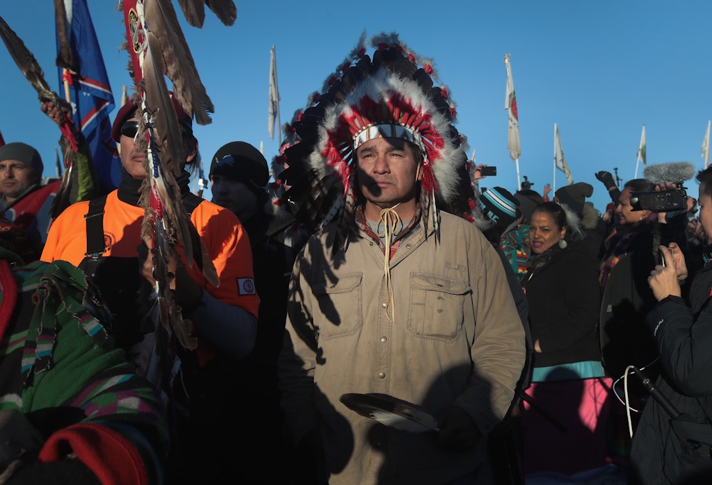 CANNON BALL, ND - DECEMBER 04:  Native American and other activists celebrate after learning an easement had been denied for the Dakota Access Pipeline at Oceti Sakowin Camp on the edge of the Standing Rock Sioux Reservation on December 4, 2016 outside Cannon Ball, North Dakota. The US Army Corps of Engineers announced today that it will not grant an easement to the Dakota Access Pipeline to cross under a lake on the Sioux Tribes Standing Rock reservation, ending a  months-long standoff.  (Photo by Scott Olson/Getty Images)