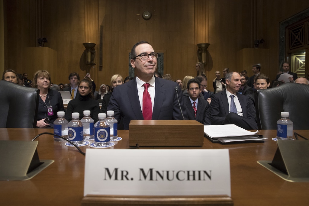 Treasury Secretary-designate Stephen Mnuchin arrives on Capitol Hill in Washington, Thursday, Jan. 19, 2017, to testify at his confirmation hearing before the Senate Finance Committee. Mnuchin built his reputation and his fortune as a savvy Wall Street investor but critics charge that he profited from thousands of home foreclosures as the chief of a sub-prime mortgage lender during the housing collapse. (AP Photo/J. Scott Applewhite)