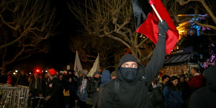 BERKELEY, CA - FEBRUARY 1: Protesters march off the UC Berkeley campus on February 1, 2017 in Berkeley, California. A scheduled speech by controversial Breitbart writer Milo Yiannopoulos was cancelled after protesters and police engaged in violent skirmishes. (Photo by Elijah Nouvelage/Getty Images)