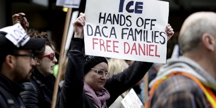 People march to protest the detention of Daniel Ramirez Medina, a Deferred Action for Childhood Arrivals (DACA) recipient, by US Immigration and Customs Enforcement (ICE) in Seattle, Washington on February 17, 2017. Lawyers for Ramirez Medina said his arrest -- for the purpose of expulsion -- was a first among people included in the so-called DACA program protecting unauthorized immigrants who were brought to the United States as children. / AFP / Jason Redmond (Photo credit should read JASON REDMOND/AFP/Getty Images)