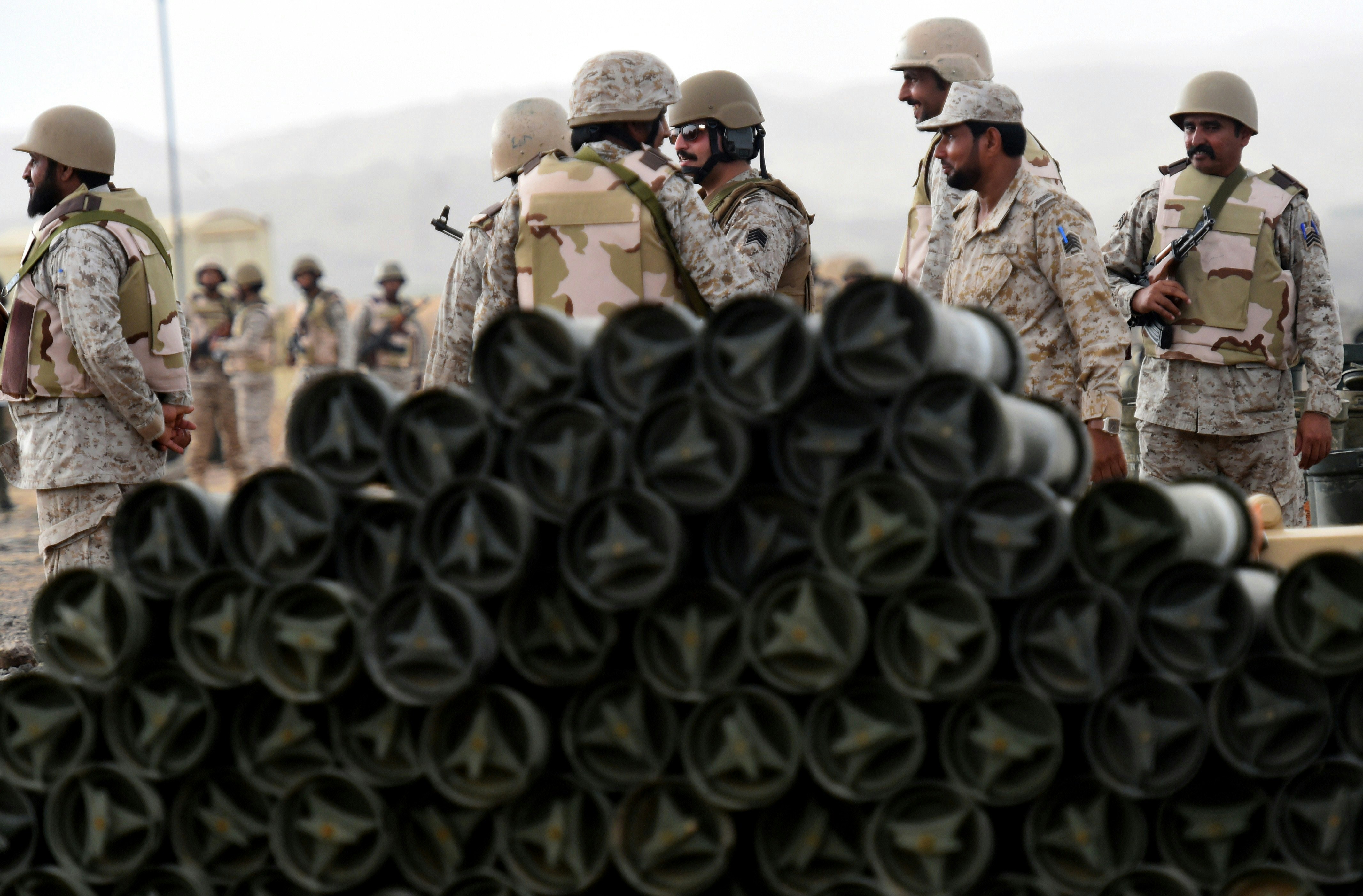 Saudi soldiers from an artillery unit stand behind a pile of ammunition at a position close to the Saudi-Yemeni border, in southwestern Saudi Arabia, on April 13, 2015. Saudi Arabia is leading a coalition of several Arab countries which since March 26 has carried out air strikes against the Shiite Huthis rebels, who overran the capital Sanaa in September and have expanded to other parts of Yemen. AFP PHOTO / FAYEZ NURELDINE        (Photo credit should read FAYEZ NURELDINE/AFP/Getty Images)
