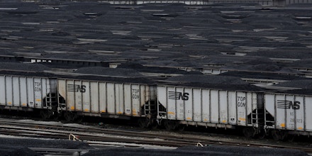 Loaded Norfolk Southern coal trains sit before being unloaded at Lambert's Point Coal Terminal in Norfolk, Virginia, U.S., on Tuesday, Nov. 26, 2013. In 2011, coal was used to generate 30.3 percent of the world's primary energy, the highest level since 1969, according to the World Coal Association, an industry trade group. That share slipped only to 29.9 percent last year. Photographer: Luke Sharrett/Bloomberg via Getty Images