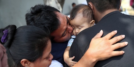 GUATEMALA CITY, GUATEMALA - FEBRUARY 09: Guatemalan deportee Eric Perez, 23, kisses his daughter Kimberly, 18 months, after he arrived on an ICE deportation flight on February 9, 2017 to Guatemala City, Guatemala. The charter jet, carrying 135 deportees, arrived from Texas, where U.S. border agents catch the largest number illigal immigrants crossing into the United States, many of them from Central America. The Guatemalan Exterior Ministry gives the deportees phone calls to their family, lunch and a ride to their towns upon their return. U.S. President Donald Trump pledged to vastly increase the number of deportations as part of his platform to crack down on illegal immigration. (Photo by John Moore/Getty Images)