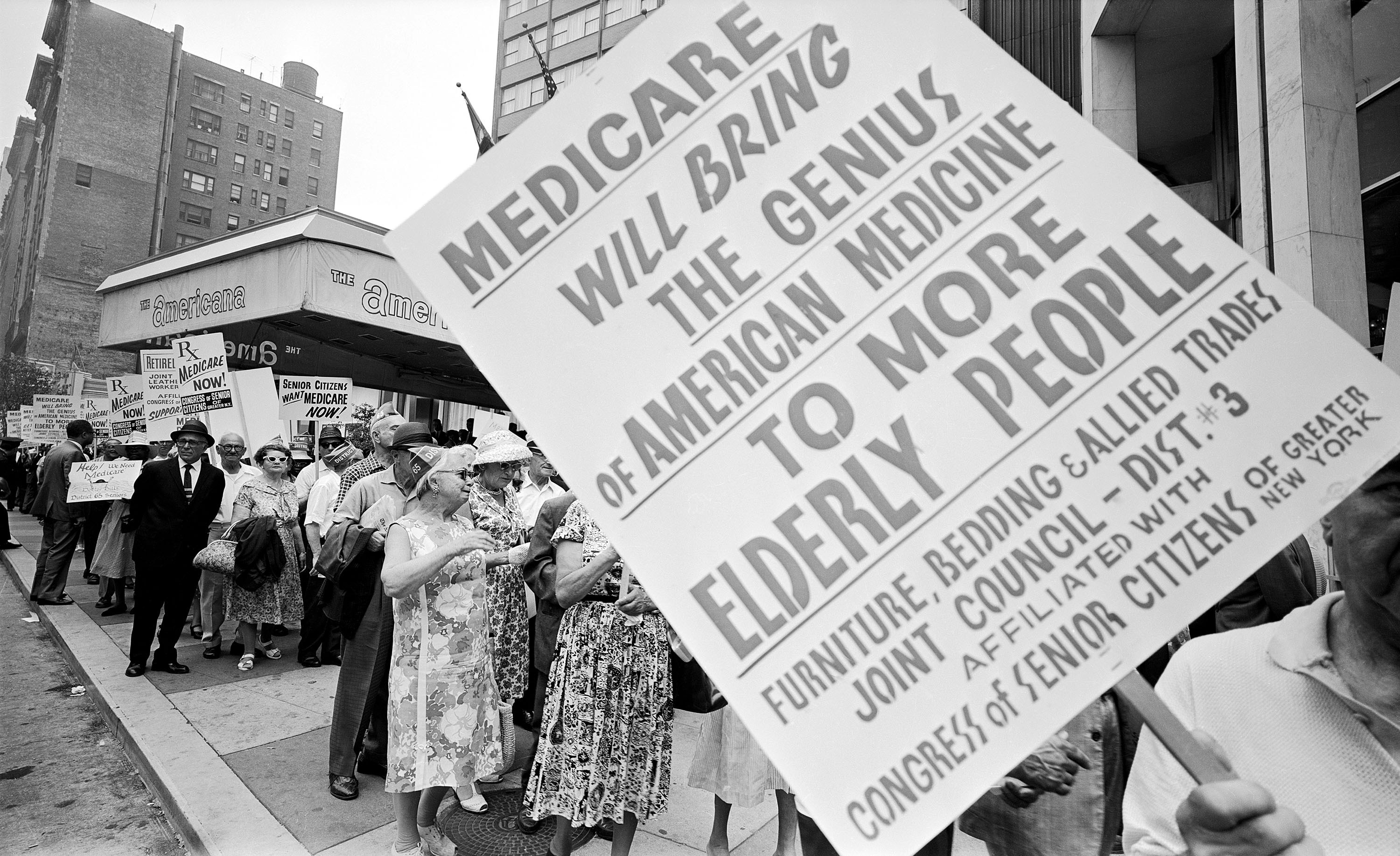 Retired Senior Citizens Carrying Pro-Medicare Signs