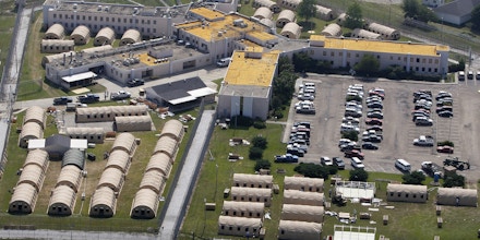 FILE - In this May 9, 2011, file photo, the Louisiana State Penitentiary at Angola, La., is viewed. As summer approaches in Louisiana, prison officials insist that ice, fans and cold showers are enough to protect death-row inmates from dangerous heat and humidity. If not, a federal judge may order them to install air conditioning for inmates awaiting execution at the penitentiary in Angola. (AP Photo/Patrick Semansky, File)