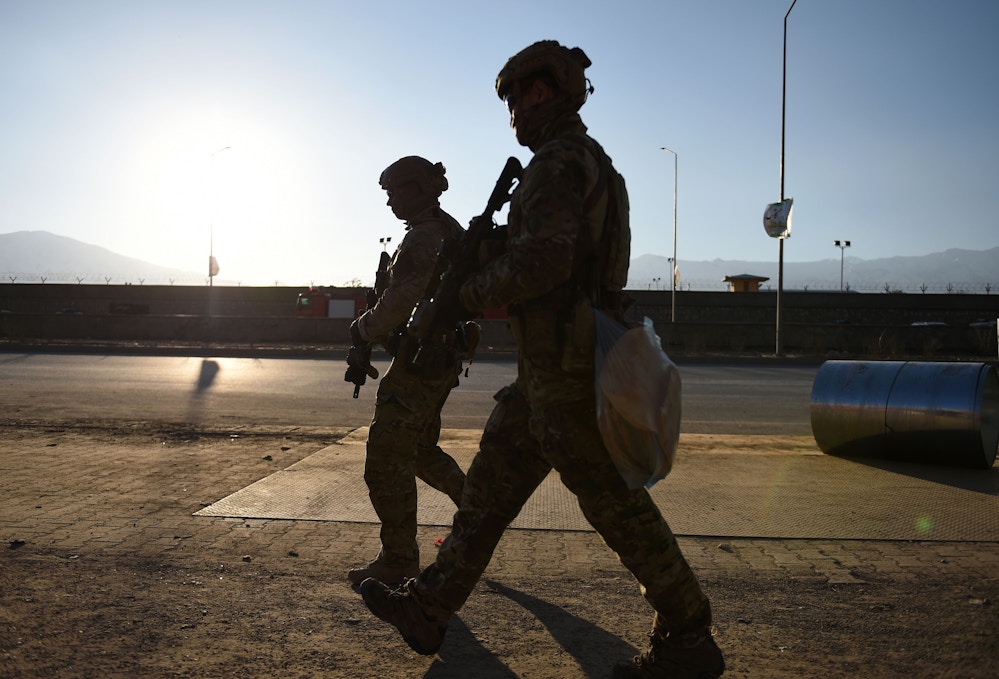 US soldiers arrive at the site of a suicide car bombing that targeted an Afghan police district headquarters building as a gun battle continues between Taliban and Afghan security forces in Kabul on March 1, 2017.Explosions and gunfire echoed through Kabul after near simultaneous Taliban suicide assaults on two security compounds, as the insurgents ramp up attacks even before the start of their annual spring offensive. / AFP / WAKIL KOHSAR (Photo credit should read WAKIL KOHSAR/AFP/Getty Images)