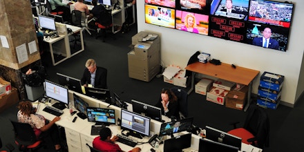 Journalists work in the main newsroom area of the new Al Jazeera America television broadcast studio on West 34th Street August 16, 2013 in New York. Al Jazeera America, which will launch on August 20, will have its headquarters in New York. AFP PHOTO/Stan HONDA        (Photo credit should read STAN HONDA/AFP/Getty Images)