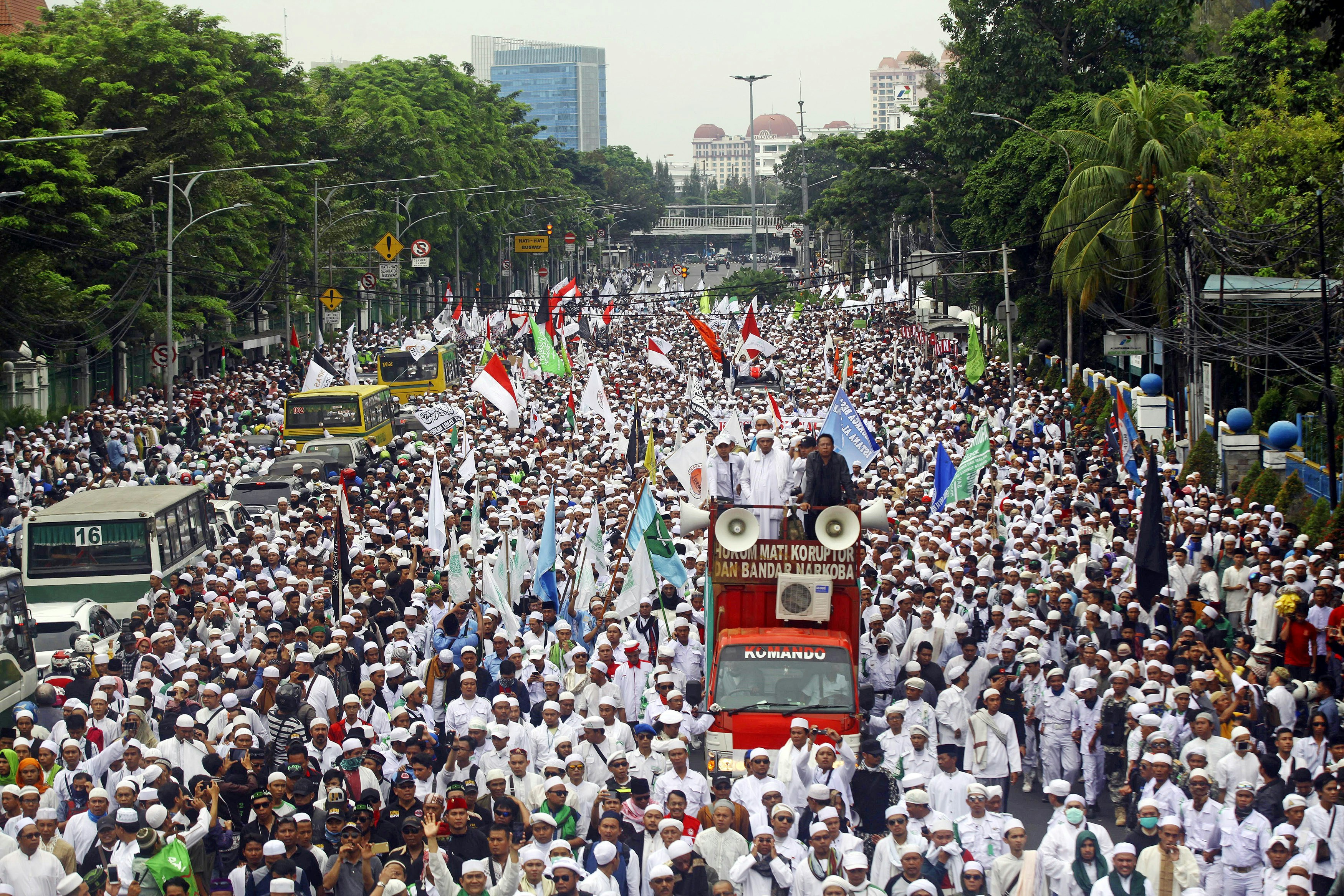 JAKARTA, INDONESIA - OCTOBER 14 : Thousands of the hardline Islamic Defenders Front (FPI) member take part in a protest in Jakarta, Indonesia, on October 14, 2016 to show their disapproval for Governor Basuki Tjahaja Purnama, better known by his nickname "Ahok", after the governors controversial purportedly anti-Islamic speech. Although Jakarta governor Ahok was quoted out of context giving a speech that was interpreted by hardliners as anti-Islamic and blasphemy in Jakarta earlier this month, the Islamic Defenders Front (FPI) group are staging a large protest to show their disdain for the politician.  (Photo by Agoes Rudianto/Anadolu Agency/Getty Images)