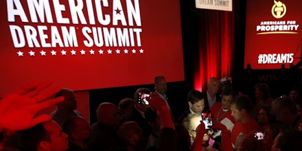 Republican presidential candidate, Sen. Marco Rubio, R-Fla., greets supporters following his speech at the Defending the American Dream summit hosted by Americans for Prosperity at the Greater Columbus Convention Center in Columbus, Ohio, Saturday, Aug. 22, 2015. (AP Photo/Paul Vernon)