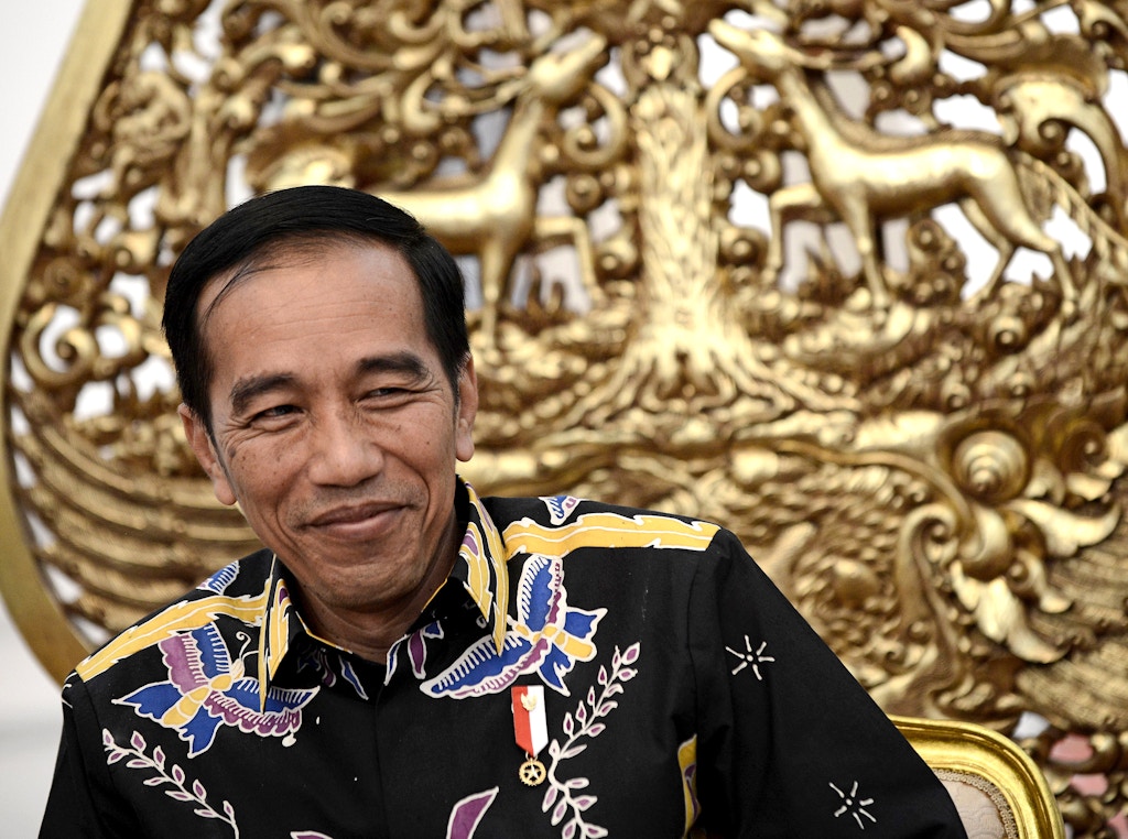 This picture taken on March 27, 2017 shows Indonesian President Joko Widodo reacting to a question during an exclusive interview with AFP at the Merdeka Palace in Jakarta. / AFP PHOTO / GOH CHAI HIN        (Photo credit should read GOH CHAI HIN/AFP/Getty Images)