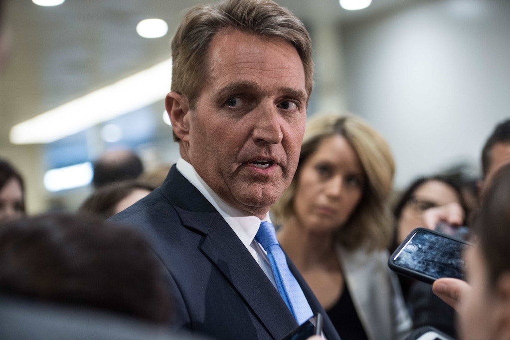 US Republican Senator from Arizona Jeff Flake speaks to reporters after a closed briefing by Joint Chiefs of Staff Gen. Joseph Dunford at the Capitol in Washington, DC, on April 7, 2017 the day after the US hit Syria. / AFP PHOTO / NICHOLAS KAMM        (Photo credit should read NICHOLAS KAMM/AFP/Getty Images)