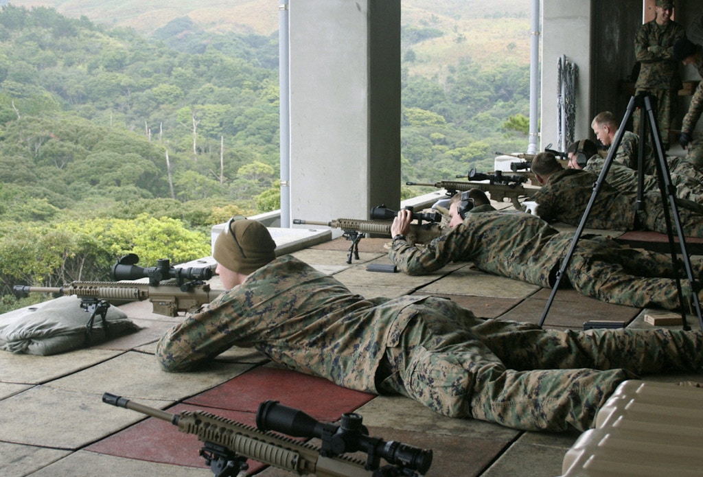NAHA, Japan - Members of the U.S. Marine Corps test fire M110 rifles, the newest model, at Camp Hansen in Okinawa Prefecture on Jan. 12, 2011. (Kyodo)