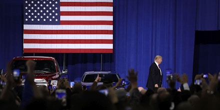 YPSILANTI, MI- MARCH 15:  U.S. President Donald Trump is cheered by auto workers at the American Center for Mobility March 15, 2017 in Ypsilanti, Michigan. Trump discussed his priorities of improving conditions to bolster the manufacturing industry and reduce the outsourcing of American jobs. (Photo by Bill Pugliano/Getty Images)