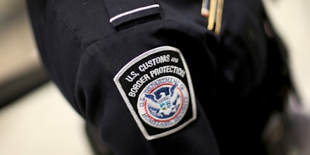 MIAMI, FL - MARCH 04:  A U.S. Customs and Border Protection officer's patch is seen as they unveil a new mobile app for international travelers arriving at Miami International Airport on March 4, 2015 in Miami, Florida. Miami-Dade Aviation Department and U.S. Customs and Border Protection (CBP) unveiled a new mobile app for expedited passport and customs screening. The app for iOS and Android devices allows U.S. citizens and some Canadian citizens to enter and submit their passport and customs declaration information using their smartphone or tablet and to help avoid the long waits in the exit lanes.  (Photo by Joe Raedle/Getty Images)