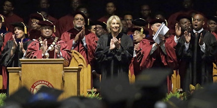 Bethune-Cookman University president Edison Jackson, left, and United States Secretary of Education Betsy DeVos applaud students as they are introduced during commencement exercises, Wednesday, May 10, 2017, in Daytona Beach, Fla. (AP Photo/John Raoux)