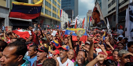 Supporters of Venezuelan President Nicolas Maduro take part in a rally against the secretary general of the Organization of American States (OAS), Luis Almagro, in Caracas on March 28, 2017. / AFP PHOTO / FEDERICO PARRA (Photo credit should read FEDERICO PARRA/AFP/Getty Images)