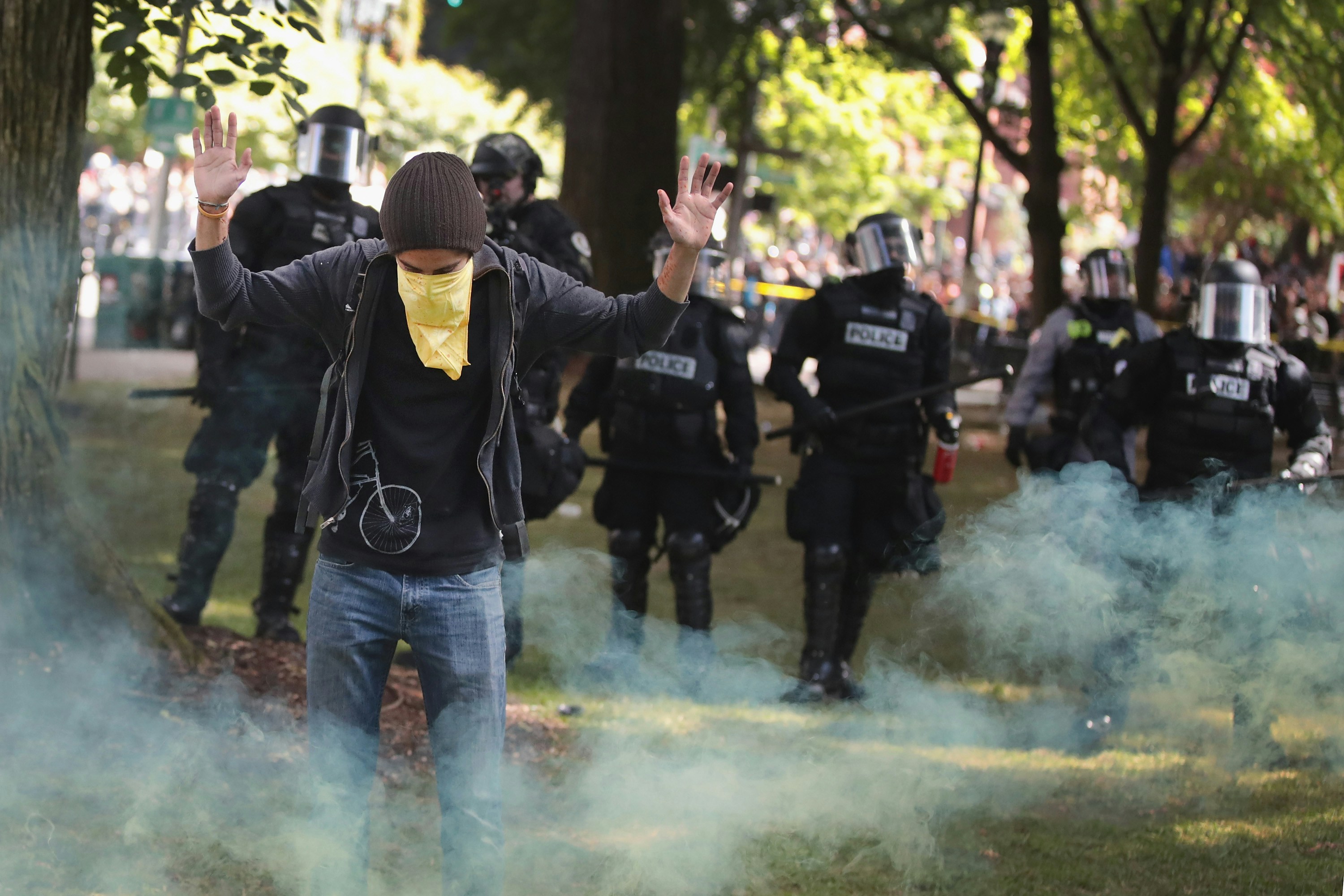 PORTLAND, OR - JUNE 04:  Antifascist demonstrators confront police during a protest on June 4, 2017 in Portland, Oregon. A protest dubbed "Trump Free Speech" by organizers was met by a large contingent of counter-demonstrators who viewed the protest as a promotion racism. Many residents of Portland are still coming to terms with the recent violent attack on the city's MAX train line when Ricky Best, 53, and Taliesin Namkai-Meche, 23, were stabbed to death and Micah Fletcher,21, was severely injured after they tried to protect two teenage girls, one of whom was wearing a hijab, from being harassed with racial taunts by suspect Jeremy Christian.  (Photo by Scott Olson/Getty Images)