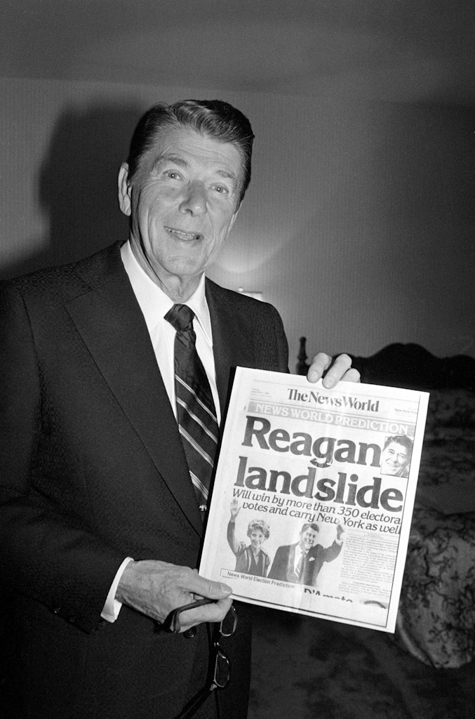 Ronald Reagan beat President Jimmy Carter handily on November 4. Reagan is shown holding a November 4th copy of The News World, predicting his landslide over Carter for the President of the United States.