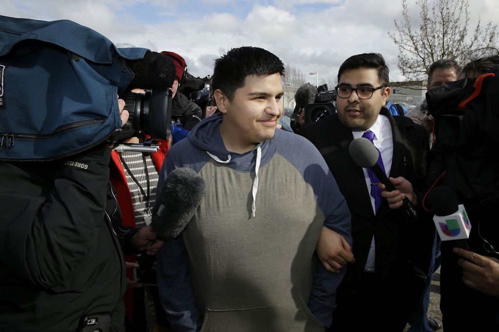 Daniel Ramirez Medina, center, briefly talks to reporters as he walks with his attorney, Luis Cortes, right, after Ramirez was freed from custody at the Northwest Detention Center in Tacoma, Wash., Wednesday, March 29, 2017. Ramirez had spent more than six weeks in immigration detention despite his participation in a program designed to prevent the deportation of those brought to the U.S. illegally as children. (AP Photo/Ted S. Warren)